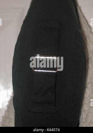 belt buckle metal black fabric cotton tied ; Essex; England; UK Stock Photo
