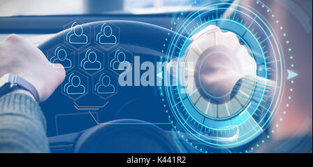 Digital composite of volume knob with graphs against man holding the steering wheel of his car Stock Photo