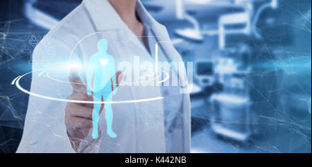 Midsection of female doctor using digital screen against empty operation room Stock Photo