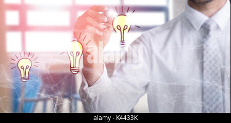 Mid section of businessman writing with marker against chairs and table arranged by stairs Stock Photo