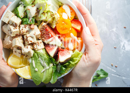 buddha bowl, vegan lunch, tofu fruit vegetables salad. Stock Photo