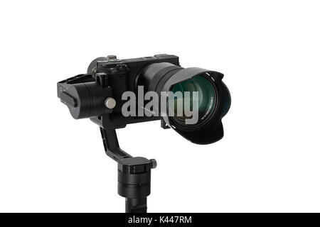 3-axis gimbals Stabilization System with Mirrorless Camera. Using this equipment, a Videographer can take video without shaking. Stock Photo
