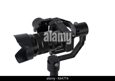 3-axis gimbals Stabilization System with Mirrorless Camera. Using this equipment, a Videographer can take video without shaking. Stock Photo