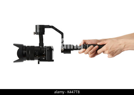 3-axis gimbals Stabilization System with Mirrorless Camera. Using this equipment, a Videographer can take video without shaking. Stock Photo
