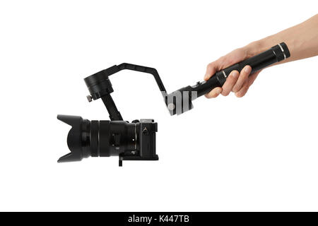 3-axis gimbals Stabilization System with Mirrorless Camera. Using this equipment, a Videographer can take video without shaking. Stock Photo