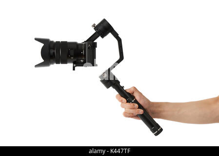 3-axis gimbals Stabilization System with Mirrorless Camera. Using this equipment, a Videographer can take video without shaking. Stock Photo