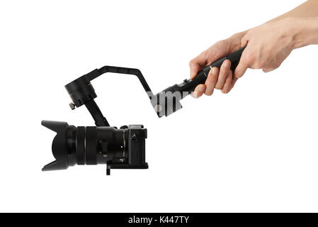 3-axis gimbals Stabilization System with Mirrorless Camera. Using this equipment, a Videographer can take video without shaking. Stock Photo