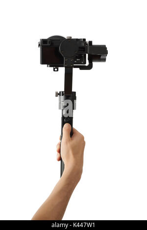 3-axis gimbals Stabilization System with Mirrorless Camera. Using this equipment, a Videographer can take video without shaking. Stock Photo