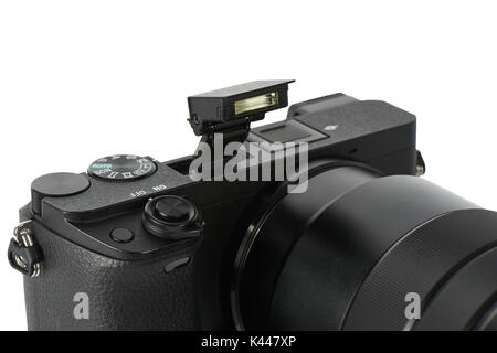 Closeup of pop-up flash on a mirrorless interchangeable lens camera ...