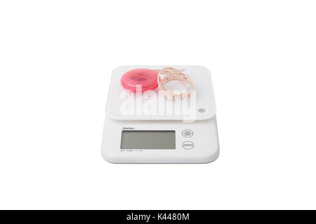 white food scales with pink tapeline for measuring body size, isolated on white Stock Photo