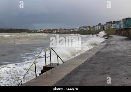 Dark clouds and breaking waves at Ballyholme Beach promenade in Bangor Northern Ireland  during a winter storm in January 2017 Stock Photo