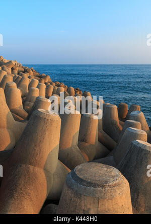 Seascape with concrete tetrapods at sunset in Jeju Island, Korea Stock Photo