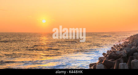 Seascape with concrete tetrapods at sunset in Jeju Island, Korea Stock Photo