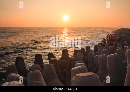 Seascape with concrete tetrapods at sunset in Jeju Island, Korea Stock Photo