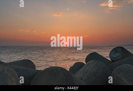 Seascape with concrete tetrapods at sunset in Jeju Island, Korea Stock Photo