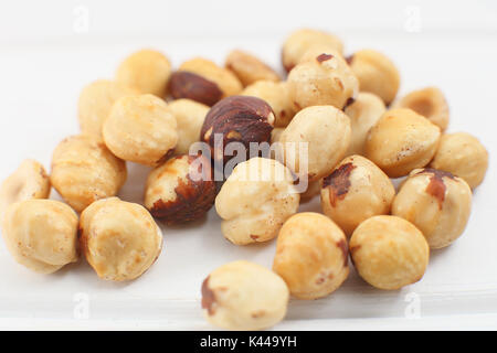 A bunch  hazelnuts on a white background. Stock Photo
