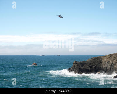 Porthcothan Cornwall UK, 4th September 2017. A coastguard helicopter, three lifeboats and emergency services on the cliffs carry out a search for a man missing from the rocks off at Fox’s Cove on the north Cornish coast.  The area between Porthcothan and Treyarnon Bay west of Padstow is made of numerous rocky inlets.  Credit: Julian Eales/Alamy Live News Stock Photo