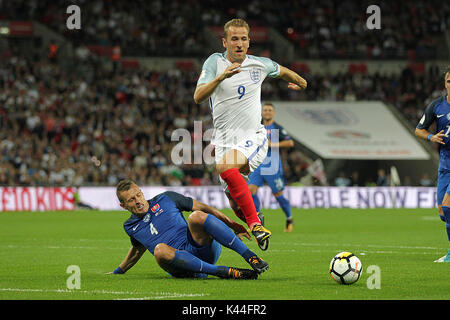 London, UK. 04th Sep, 2017. Harry Kane of England is tackled by Ján Ďurica of Slovakia during the FIFA World Cup 2018 Qualifying Group F match between England and Slovakia at Wembley Stadium on September 4th 2017 in London, England. (Photo by Matt Bradshaw/phcimages.com) Credit: PHC Images/Alamy Live News Stock Photo