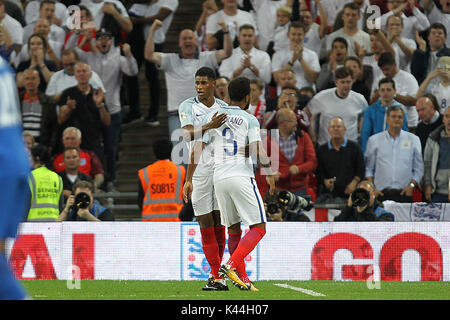 Marcus Rashford of England celebrates with Ryan Bertrand (R) after scoring the winning goal during the FIFA World Cup 2018 Qualifying Group F match between England and Slovakia at Wembley Stadium on September 4th 2017 in London, England. (Photo by Matt Bradshaw/phcimages.com) Stock Photo