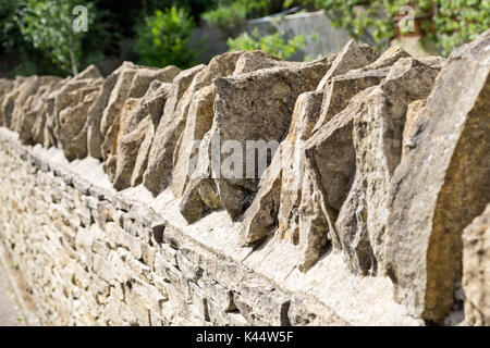 A modern Cotswold dry stone wall Stock Photo