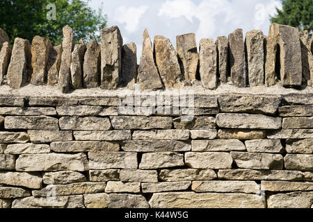 A modern Cotswold dry stone wall Stock Photo
