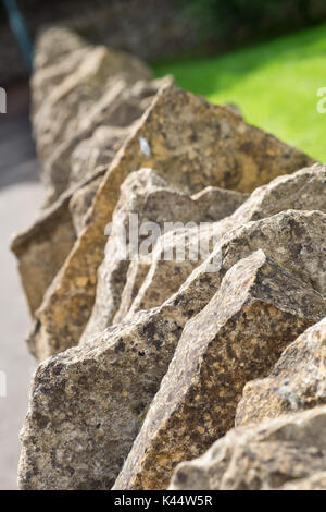 A modern Cotswold dry stone wall Stock Photo