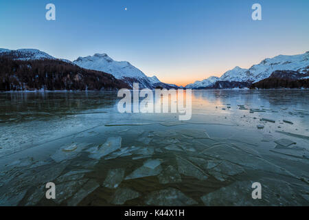 Sheets of ice on the surface of Lake Sils in a cold winter morning at dawn Upper Engadine Canton of Graubunden Switzerland Europe Stock Photo