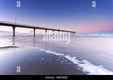 Pier at New Brighton Beach sunset view in Christchurch, South Island, New Zealand. Stock Photo