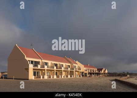 CAPE CROSS, NAMIBIA - JUNE 28, 2017: Part of the lodge at Cape Cross at sunset in the Dorob National Park of Namibia Stock Photo