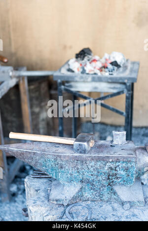 Old hammer and rusty anvil Stock Photo