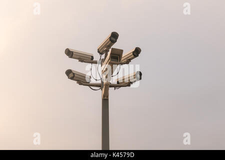 Six cctv security cameras on the street pylon. Security cameras mounting on the high top position Stock Photo