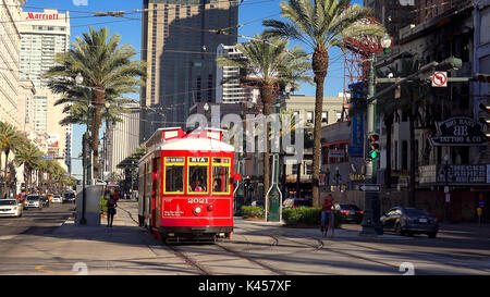 Red streetcar on Canal Street in downtown New Orleans, Louisiana Stock Photo