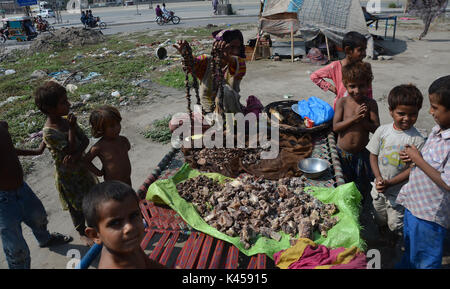 Lahore, Pakistan. 05th Sep, 2017. Gypsy family hang strips of salted meat collected from different places preserve for longer time to use during the Muslims Eid al-Adha or Festival of Sacrifice. Credit: Rana Sajid Hussain/Pacific Press/Alamy Live News Stock Photo