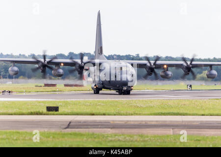 A US Air Force MC-130J Commando II Hercules leaves the runway at RAF Mildenhall after finishing a training sortie in the UK. Stock Photo