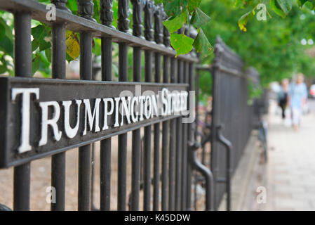 Trumpington Street sign in Cambridge city centre along the black railings