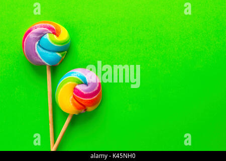 rainbow lollipop on color background Stock Photo