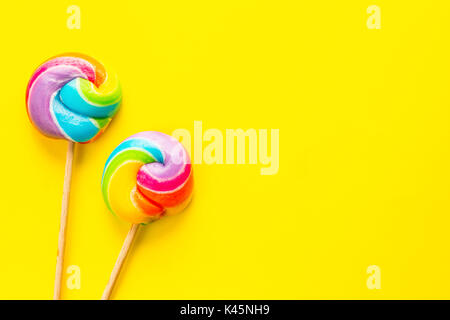 rainbow lollipop on color background Stock Photo