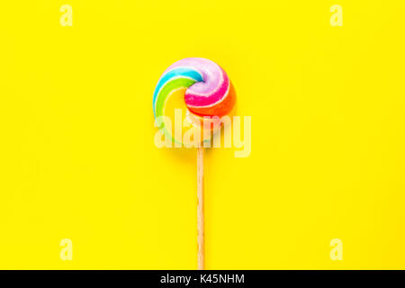 rainbow lollipop on color background Stock Photo
