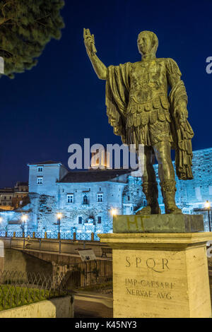 Imperial Forum, Rome, Lazio, Italy. The Statue of Emperor Julius Caesar at night Stock Photo