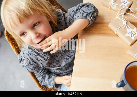 Little girl cozy at home in Christmas time Stock Photo