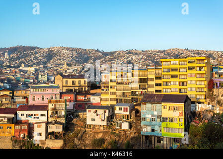 Golden light falling on the colorful hills of Valparaiso, Chile Stock Photo