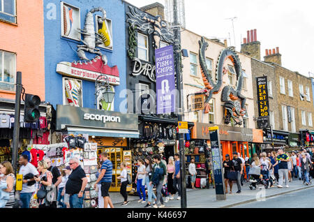 A view of shops on Camden Town High Street in London. The road is busy with tourists and shoppers. Stock Photo