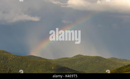 A rainbow appears over the Shenandoah mountains after a storm passed through the park Stock Photo