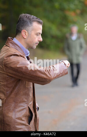 business man watching his wrist watch Stock Photo