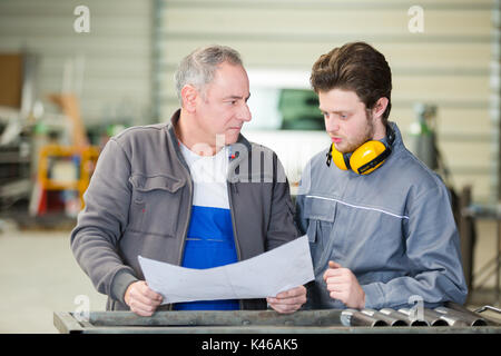 two laborers in office Stock Photo