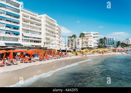 Juan les Pins, France - September 1st, 2017: Busy beach in Juan les Pins, Cote d'Azur, France. The city is famous for its annal Jazz Festival Stock Photo
