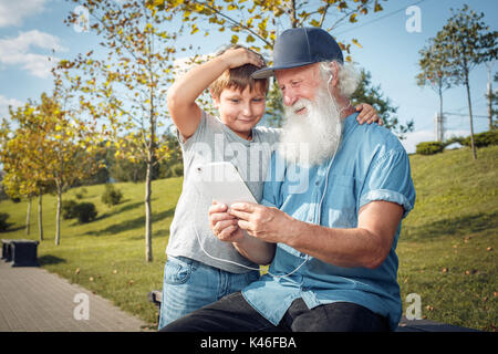 grandfather and grandson with tablet Stock Photo