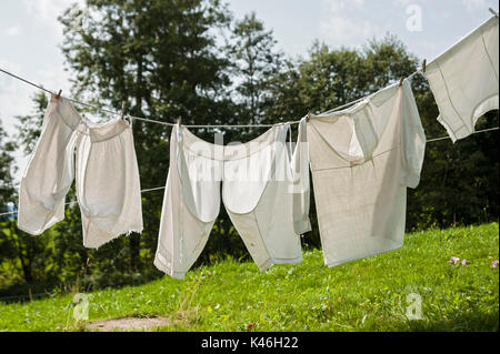 Vintage Clothesline with white Laundry Stock Photo - Alamy