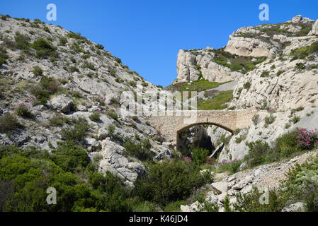 Stone Bridge on the Long Distance Coastal Footpath at Niolon on the Côte Bleue, or Blue Coast, west of Marseille Provence France Stock Photo