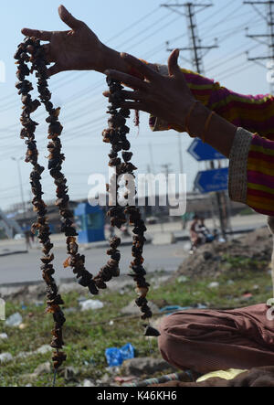 Lahore, Pakistan. 05th Sep, 2017. Gypsy family hang strips of salted meat collected from different places preserve for longer time to use during the Muslims Eid al-Adha or Festival of Sacrifice. Credit: Rana Sajid Hussain/Pacific Press/Alamy Live News Stock Photo